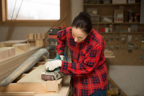 istock Carpenter  woman doing his job in carpentry workshop. 860246964