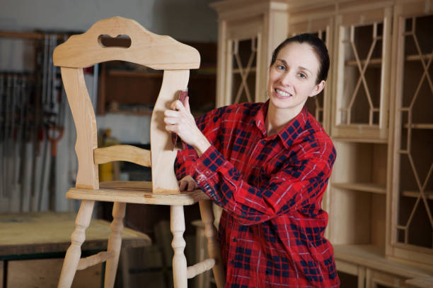 istock Carpenter  woman doing his job in carpentry workshop. 860246992