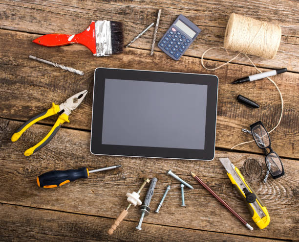 istock Different equipment tools of builder and tablet pc on wooden texture table 860247122