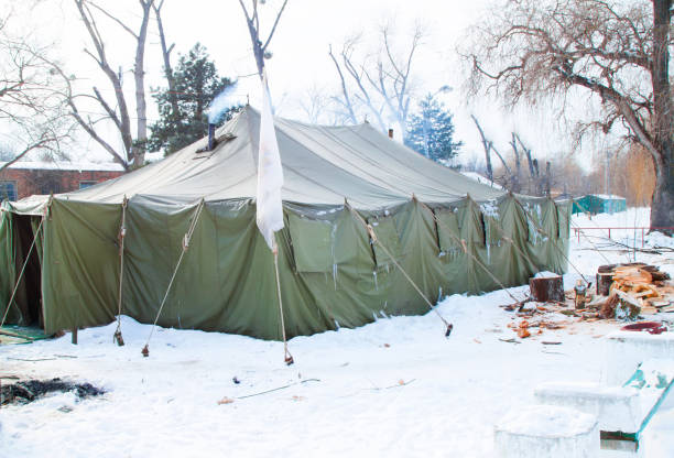 istock large military tent and many logs 860247382