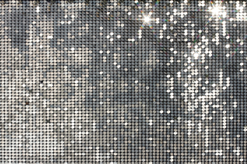 Mosaico de plata con puntos de luz y estrellas photo