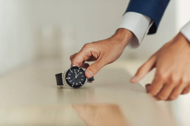 istock The man fastens the watch on his hand 860251042