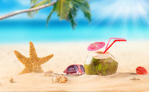 istock summer coconut cocktail on tropical beach 860254480