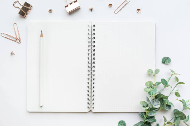 istock Top view of Mockup notepad and accessories in white background. 860255070