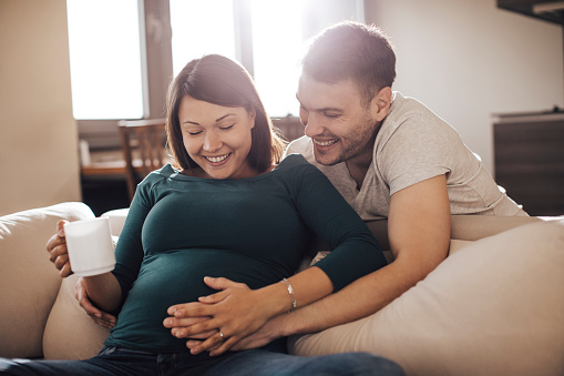 Couple feeling happy and excited because of their child