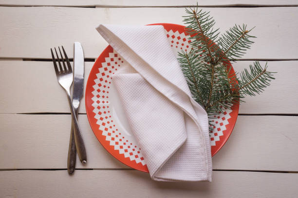 istock Christmas table place setting with dinner plates, napkin, cutlery, fir 860256016