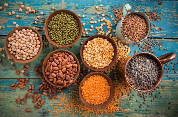 istock Raw legume on old rustic wooden table 860264280