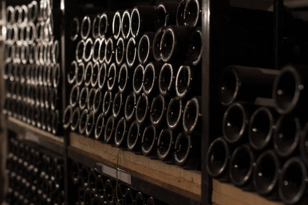istock rows of vintage wine bottles in a wine cellar 860269124