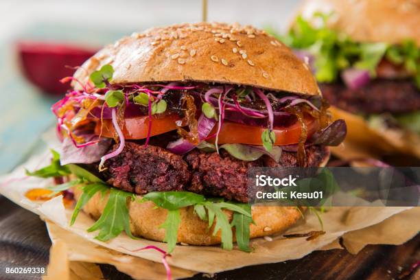 Tasty Vegetarian Beet Burgers On Wooden Table Stock Photo - Download Image Now - American Culture, Backgrounds, Barbecue - Meal