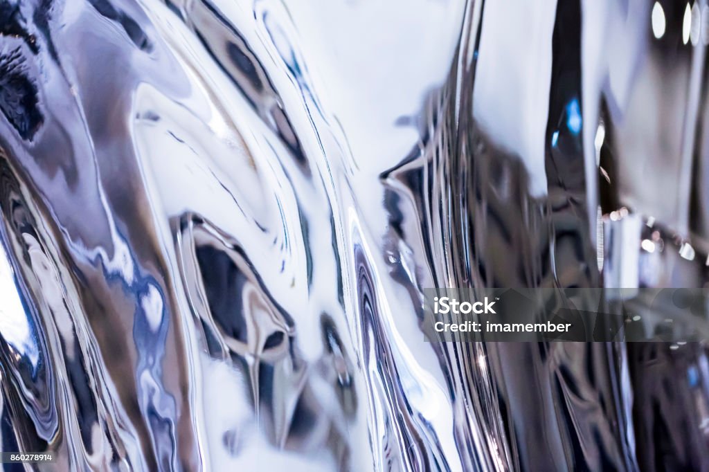 Blue abstract background, shiny metal reflection, copy space Blue shiny metal reflection, background with copy space, full frame horizontal composition Chrome Stock Photo