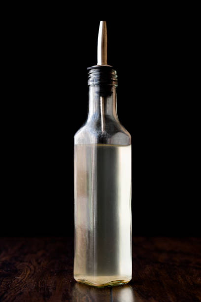 istock White Vinegar in bottle with rosemary 860285170