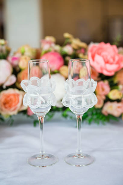 istock table serving with glasses and flowers in hall 860290824