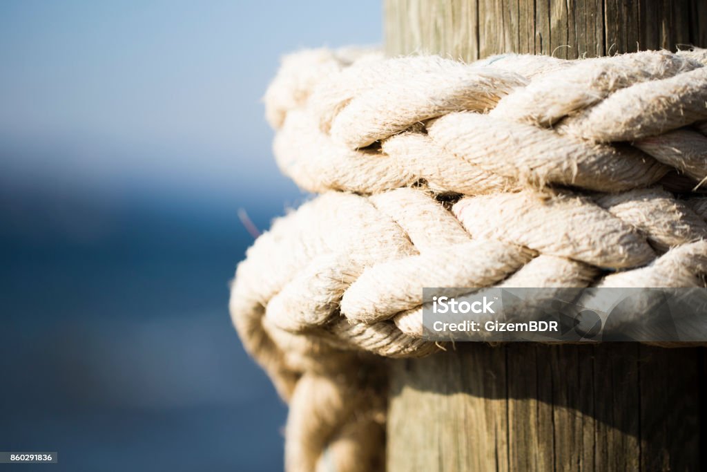 rope attached to the pier Rope Stock Photo