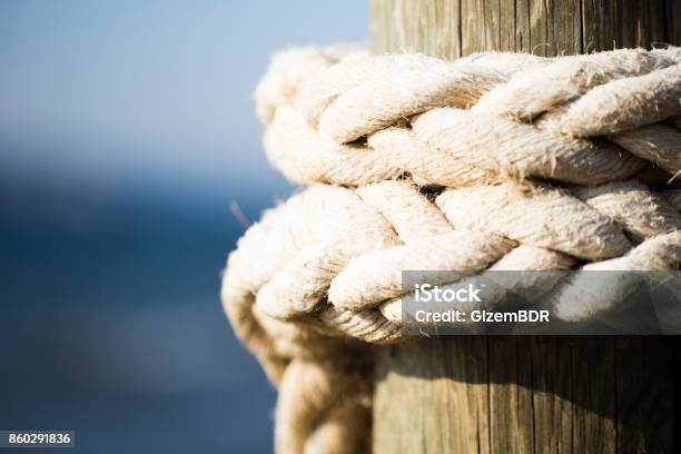 Rope Attached To The Pier Stock Photo - Download Image Now - Rope, Sea, Nautical Vessel