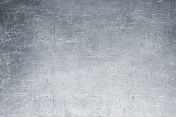 istock old metal background, bright iron texture, worn brush or sandpaper 860299878