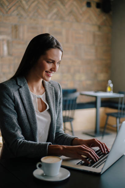 istock Beautiful business woman working in cafe bar 860305708