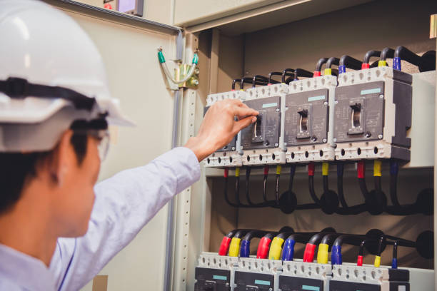 istock Engineer is check voltage or current by voltmeter in control panel of power plant. 860309594