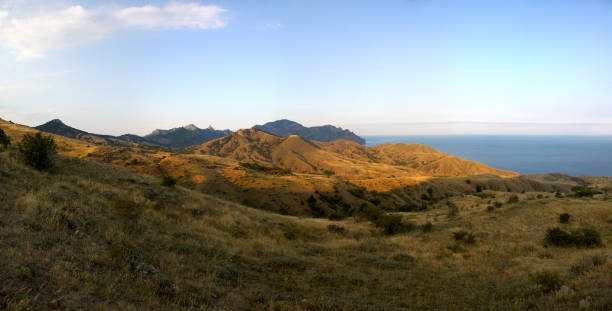 istock Beautiful landscape view of mountains, ocean, sky, on clear summ 860309630