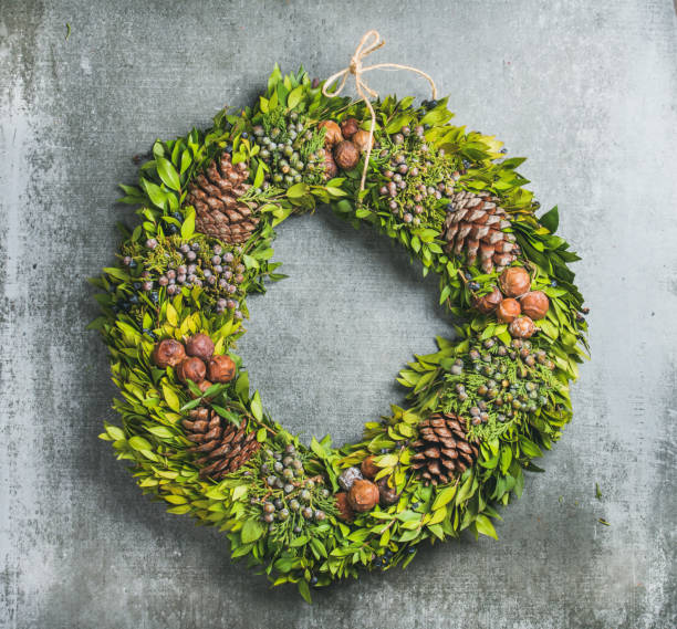 istock Christmas decorative wreath over concrete wall background 860309970
