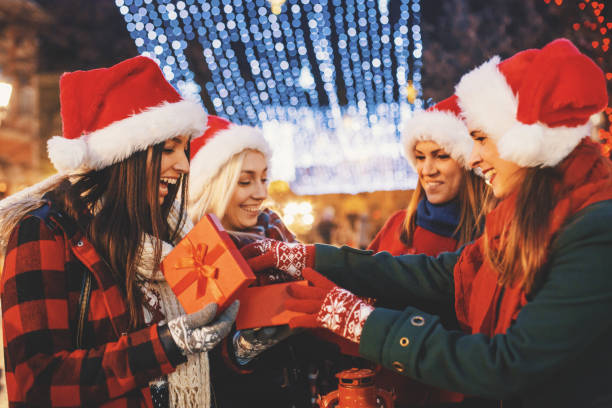 istock Friends opening gifts 860313002
