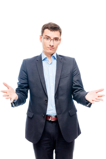istock Young man in glasses and suit on white background posing in studio 860313060