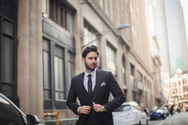 istock Gentleman in suit on the street 860313374