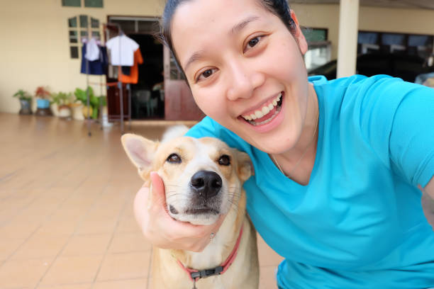 istock Asian woman selfie with dog 860313506