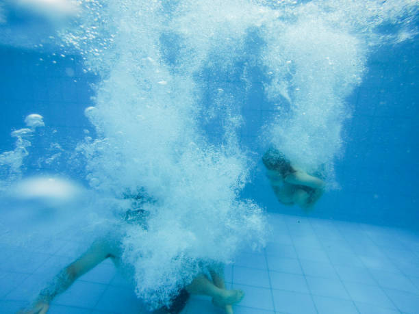 istock Family swimming underwater 860313642
