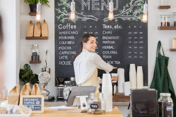 istock Female barista looks over her shoulder 860318404