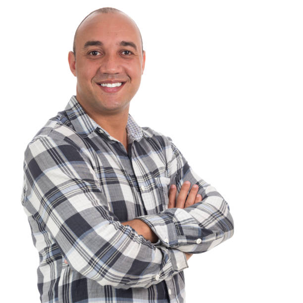 smiling man with arms crossed. the body is slightly sideways. he is bald and wears plaid shirts. - portrait human face men overweight imagens e fotografias de stock