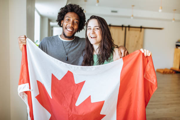 istock Couple holding Canadian Flag 860328766