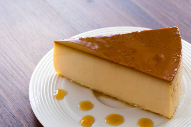 istock Homemade caramel custard pudding on white plate stay on wood table 860334316