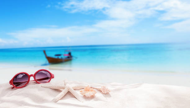 istock Summer vacation concept with accessories on sandy beach 860342084