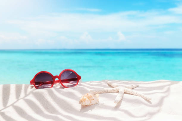 istock Summer vacation concept with accessories on sandy beach 860342102