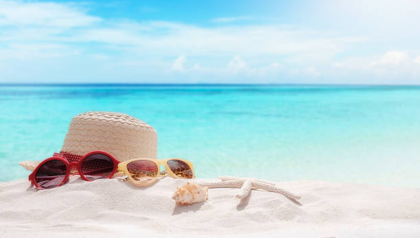 istock Summer vacation concept with accessories on sandy beach 860342118