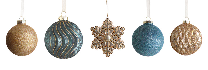 A collection of fancy Christmas ornamanents isolated on a white background.