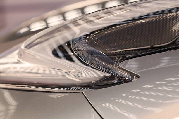 istock headlights under the reflection of lights 860345834