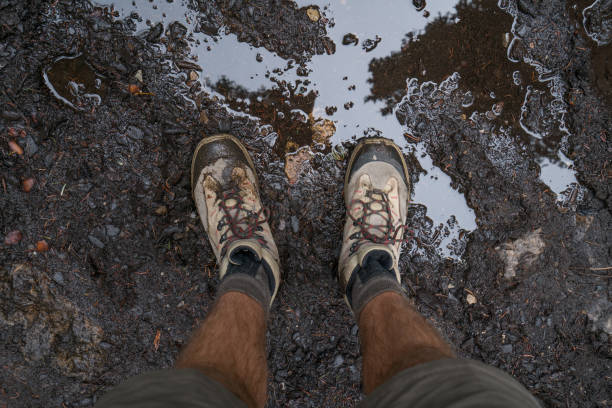 Personal perspective of man hiker resting on mountain trail