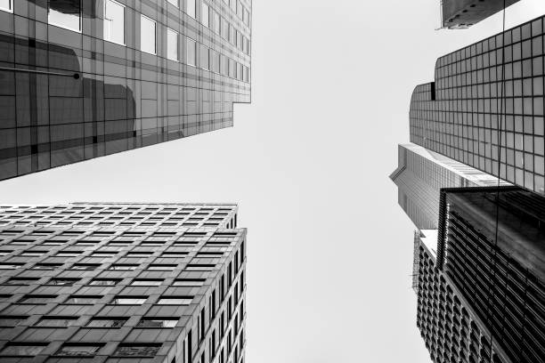 istock Modern office building close up in sunlight with B&W color 860352044