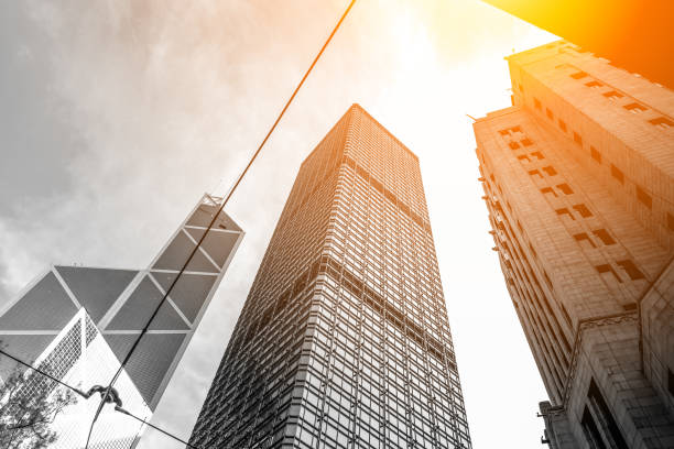 istock Modern office building close up in sunlight with B&W color 860352068