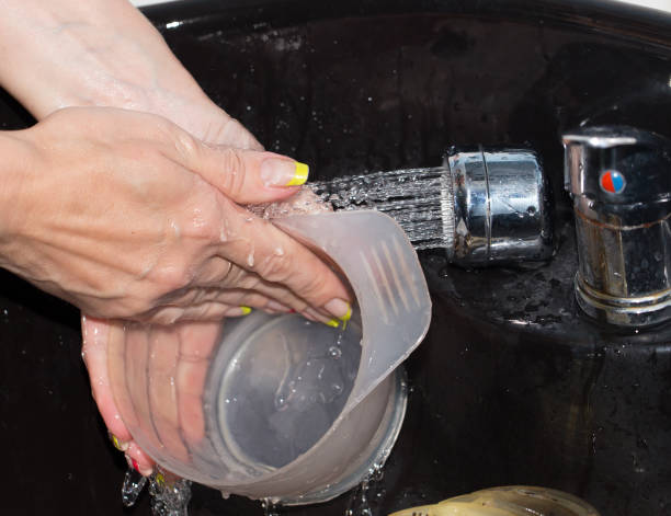 istock washing dishes in water 860358652