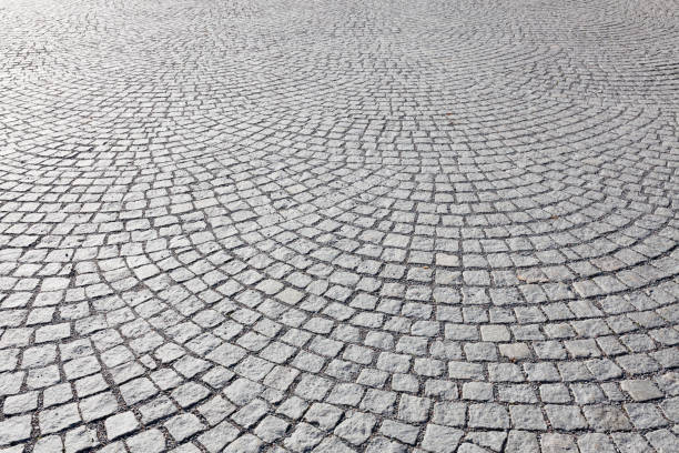 Old square stone paving Old square cobble stone paving perspective background cobblestone photos stock pictures, royalty-free photos & images