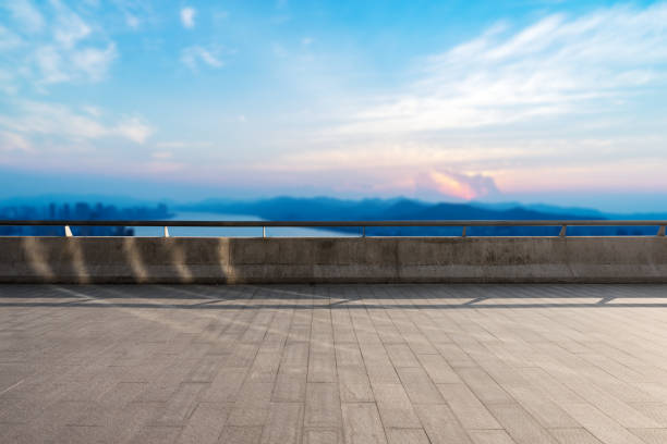 istock empty marble floor with modern city near long river 860369868
