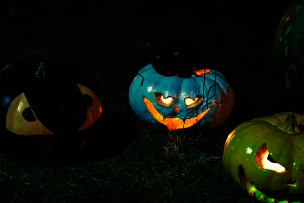 istock Halloween pumpkins on the forest trail 860373060