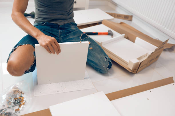 istock man assembleing furniture pieces 860373344