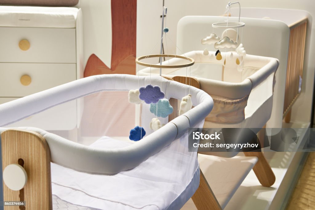 Baby cradle and crib Baby cradle and crib in store Crib Stock Photo