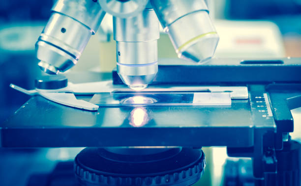 istock Close up microscope medical equipment in blue tone. 860377158
