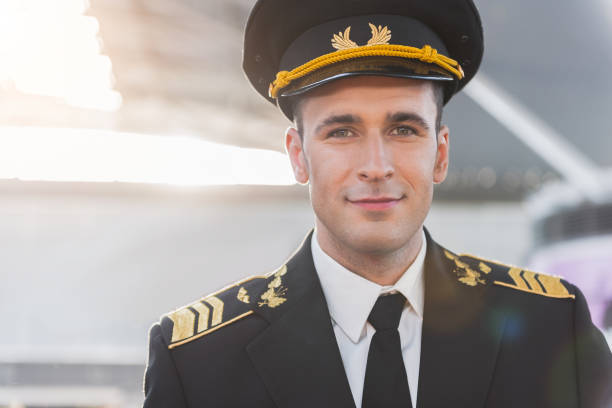 istock Happy smiling adult pilot looking ahead 860377296