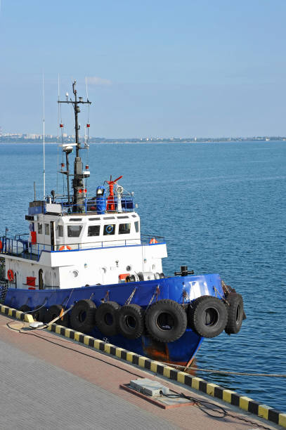 istock Tugboat in harbor quayside 860377414
