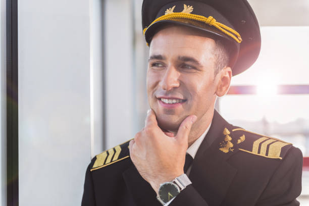istock Glad smiling aviator in airport 860378918
